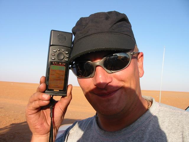 A reluctant photographic subject with the flat sandy plain in the background