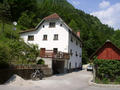 #6: The house where we reached the street after climbing down. The confluence point is on the slope just behind this house.