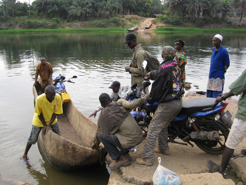 Crossing the Little Scarcies River by dugout canoe