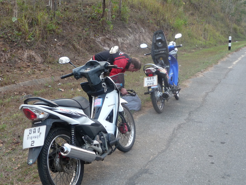 Our 2 motorcycles and Jason packing repacking his bags because they were falling off.