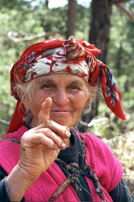 Shepherd woman on the side of the road