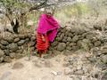 #10: Chief standing in front of one of the strange walls that makes up the Engaruka Ruins archeological site