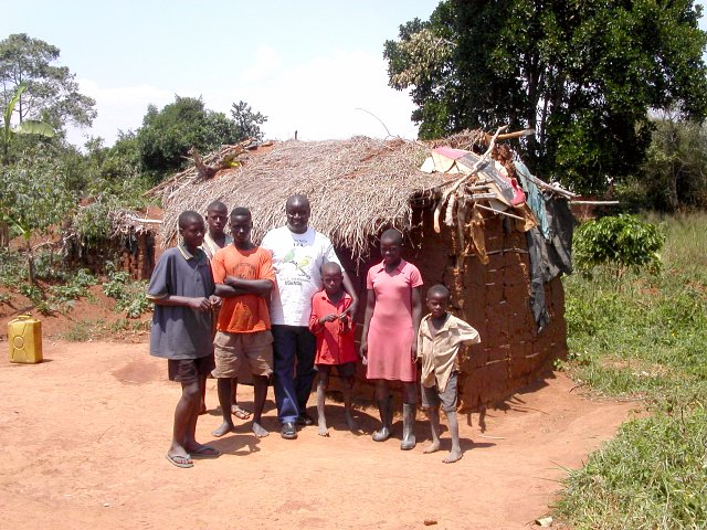 The folks who made it possible: Richard in white; Franco in blue; Lukwango in orange; the others are neighbors who gathered because of the excitement.