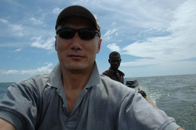 Back of the boat at confluence point - Ray and the boatman