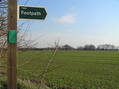 #5: Footpath sign at the start of our walk to the confluence.  The confluence is below and to the right of the "h" in "footpath", where the right-most branch points skyward.