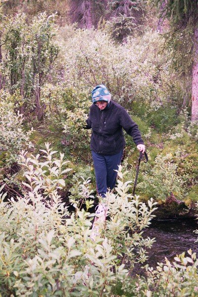 Monique crossing the stream