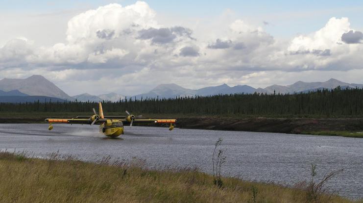 Amphibious fire fighting tanker plane takes on more water at Bettles floatport (looking to NW)