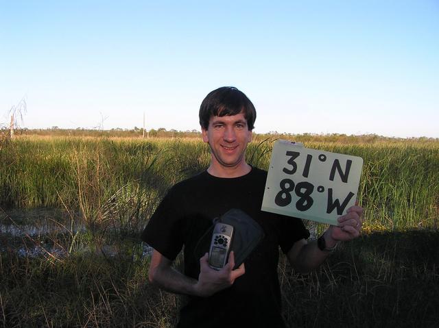 Joseph Kerski in photo taken by the Security Officer near the confluence.