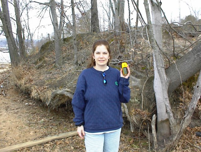 Sharon, safely back on solid sand, displays the GPS device