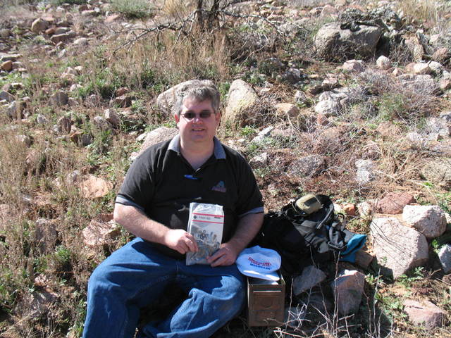 Checking out the contents of the cache - a first aid merit badge book.