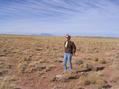 #2: Beth braves the wind at the confluence.