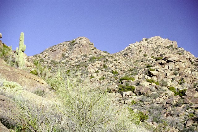 The confluence lies behind these hills