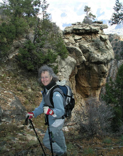 A novice confluence hunter poses with a sandstone column.