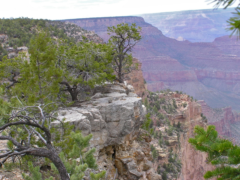 The "confluence overhang" (in the center of the photo).  The tip of this overhang lets you get as close as possible (403 feet) from the confluence point, without dropping below the rim