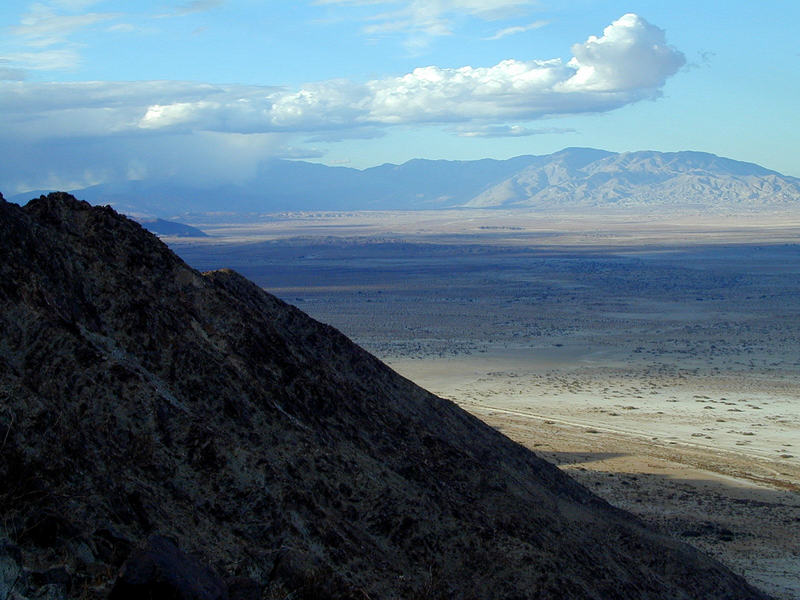 Distant rain in Anza-Borrego, as the sun leaves me