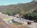 #3: View to the east-southeast from the confluence, showing the new home and arroyo.