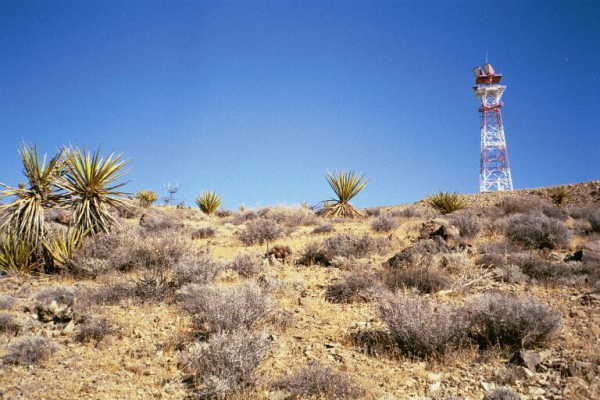 A communications tower at the top of the hill above the confluence point.