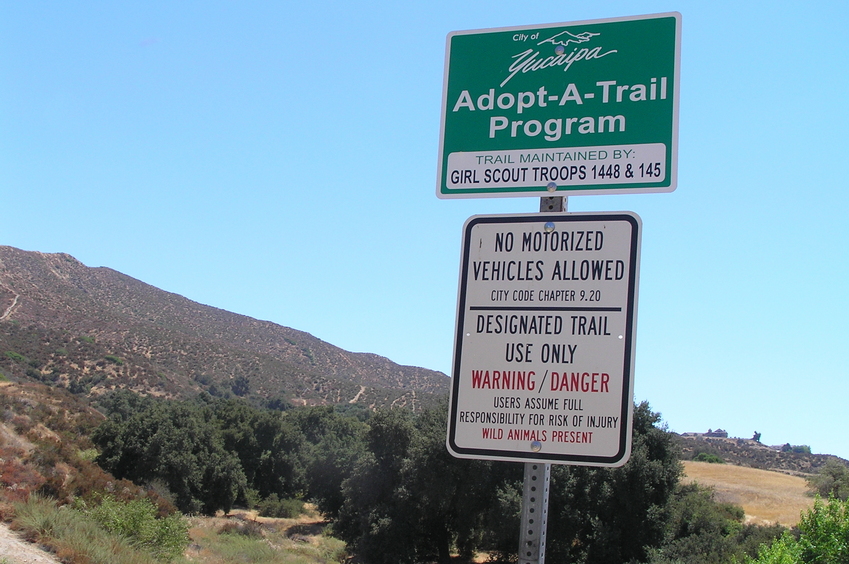 Trail sign at the beginning of the confluence trek, looking southeast toward the confluence.