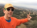 #8: Joseph Kerski at the confluence point wearing Esri GIS cap.