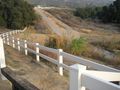 #4: The start of the trail. Down the hill, around the end of the fence, across the road, and into the trees.