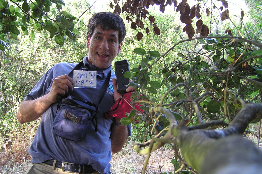 Joseph Kerski in the tree at the confluence point.