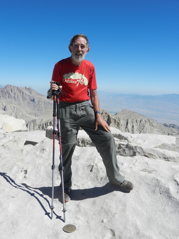 The Confluence Hunter on top of Mt. Whitney, the high point of California, in fact the tallest peak in the lower 48 (or coterminous) states.