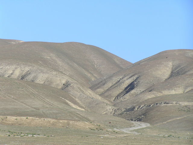 Looking north at the confluence, which is midway up the hills on the left side.