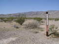 #9: Signs posted along the nearby road certify a visit to 36N 116W is a Wilderness Experience.