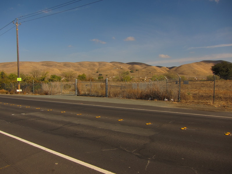 View of confluence point, 55 m beyond the chain link fence