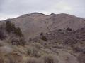 #8: Route to the confluence site, looking northeast, confluence is to the right of the highest peak in the distance.