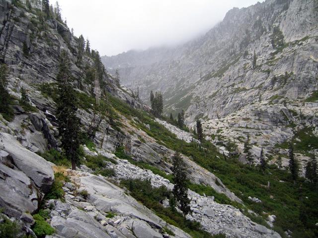 Looking West with Sapphire Lake just visible in center.  Clouds and mist coming over Sawtooth Ridge