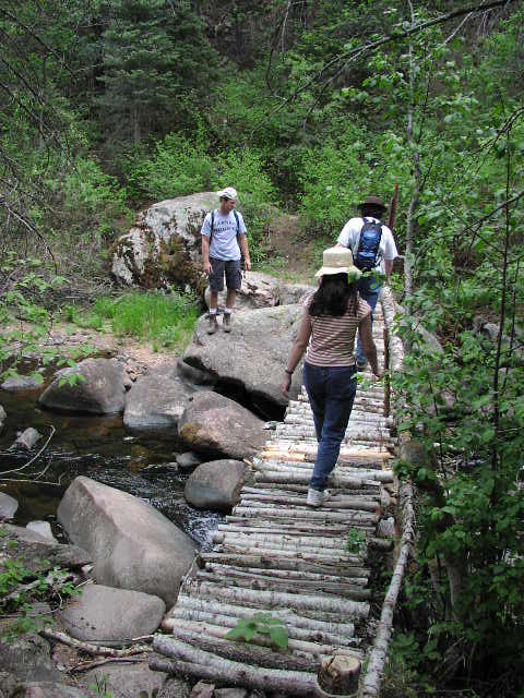 Crossing the bridge at the bottom of the ravine.