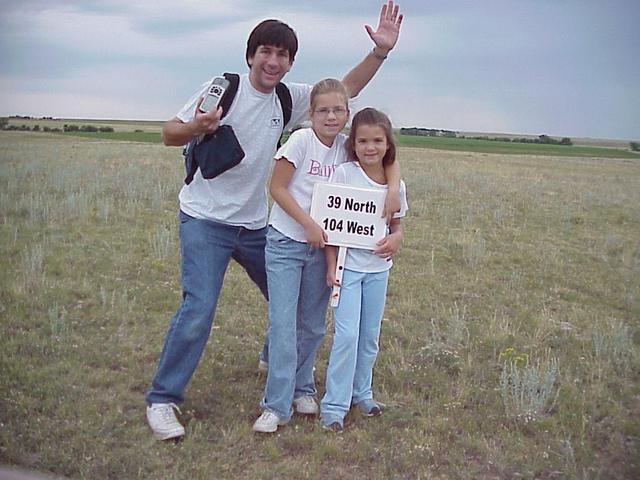 Joseph Kerski, Emily Kerski, and Lilia Kerski celebrate their arrival at the confluence.