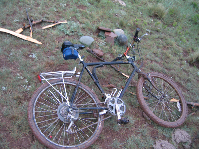 Muddy Bike and geocache at confluence