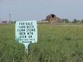 #6: Signs of the times...selling farm items and an abandoned barn, looking north from the confluence.