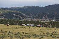 #12: A close-up view of the old farm buildings - with the electricity distribution system beyond - visible to the northeast of the point