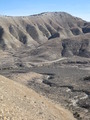 #8: View back down the mini canyon and dry creek bed toward the car, barely visible on the far left