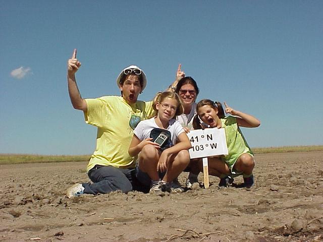 Joseph, Emily, Janell, and Lilia Kerski celebrate their arrival at the confluence.