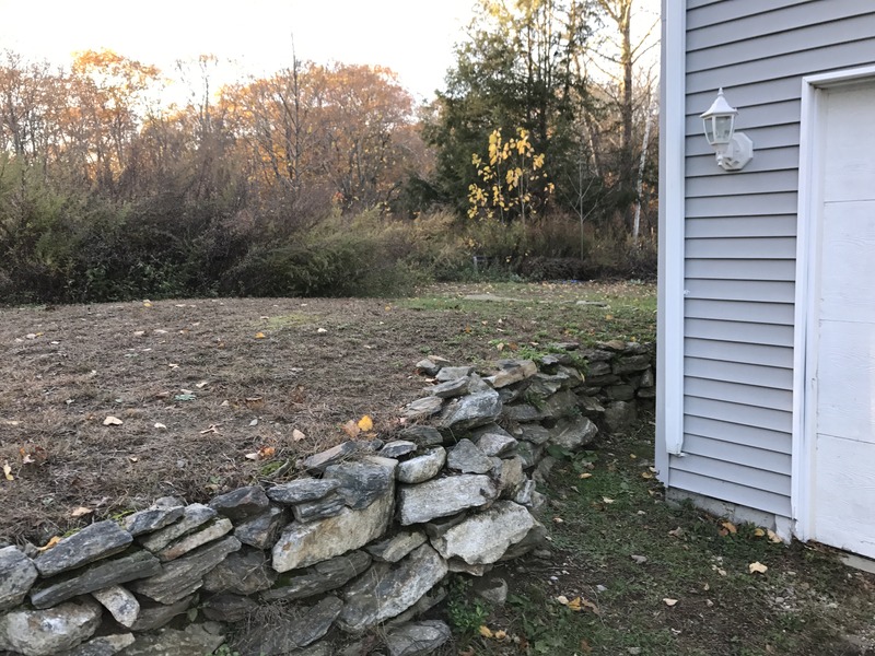 Site of 42 North 72 West, in foreground, at the rock wall, looking northwest.