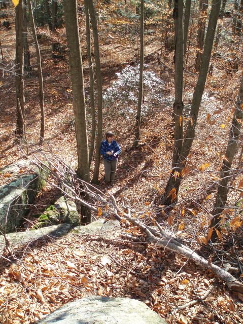 Lisa at the base of the rocks, the confluence is 30 feet behind her