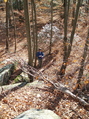 #4: Lisa at the base of the rocks, the confluence is 30 feet behind her