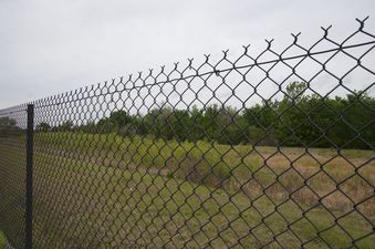 #1: View North from behind the chain-link fence, 81 feet from the confluence point, which lies in the right-hand side of this photo