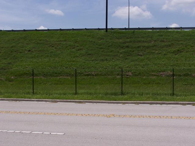 The view South with toll Hwy 570 above and N Frontage Road below.