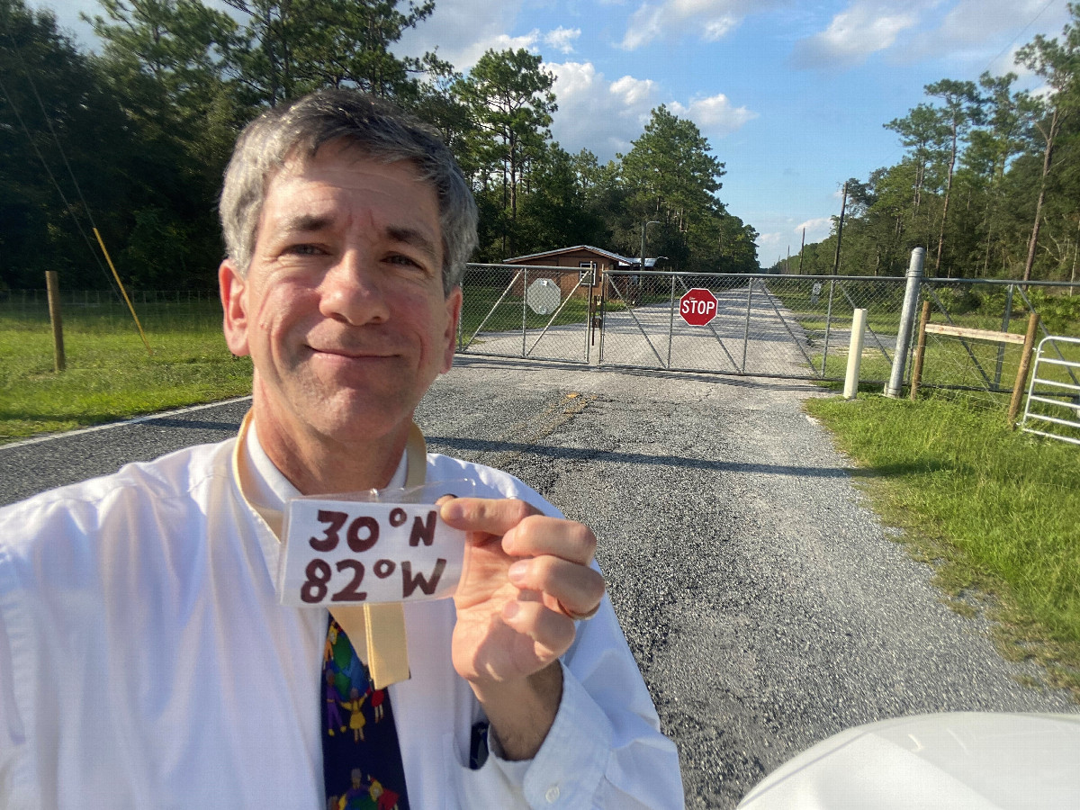 Joseph Kerski at the gate leading to the confluence. 