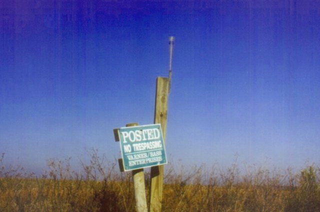 Trespassing sign with optional rain guage.