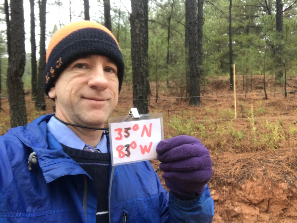 Standing in the woods in the rain and mud near 33 North 83 West. 