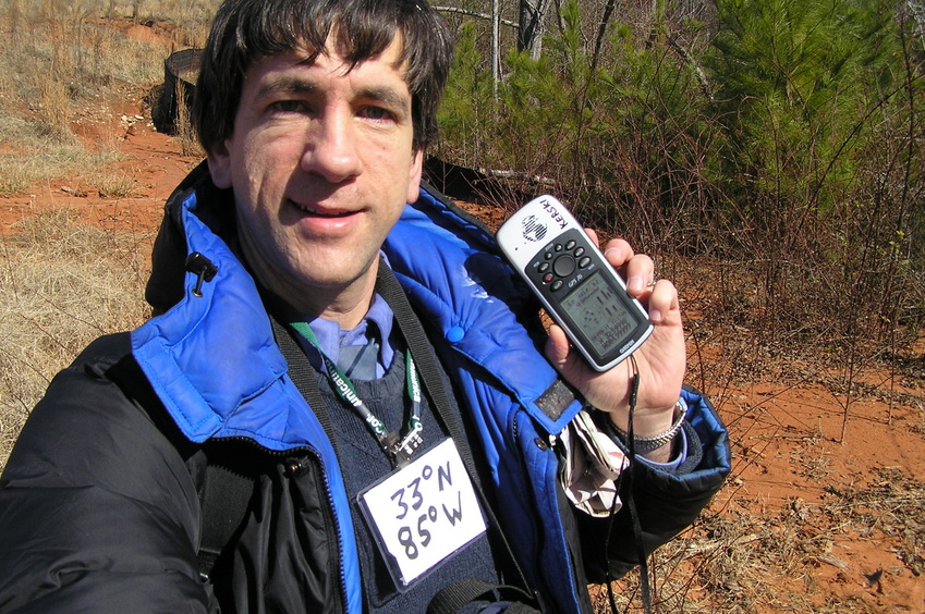 Joseph Kerski at the confluence of 33 North 85 West.