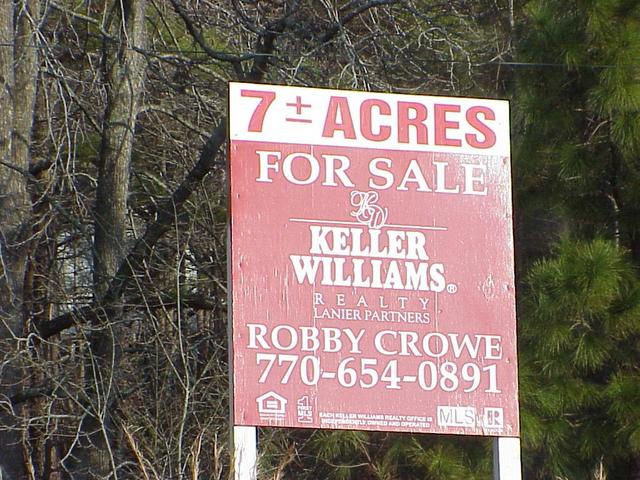 Sign of the times:  For sale sign about 2 km northeast of the confluence.