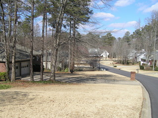 #1: Confluence point from the south.  The confluence lies just beyond the driveway, midway between the mailbox post and the front of the house.