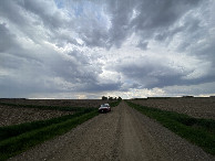 #10: Nearest road to the confluence point, looking due south, as the rain began.